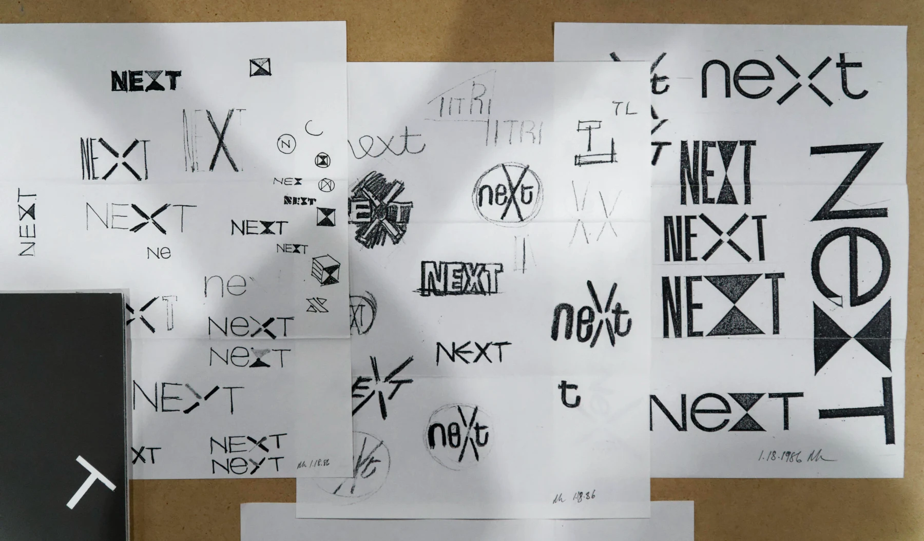 Sheets of Paul Rand’s hand-drawn NeXT lettering and cube studies.