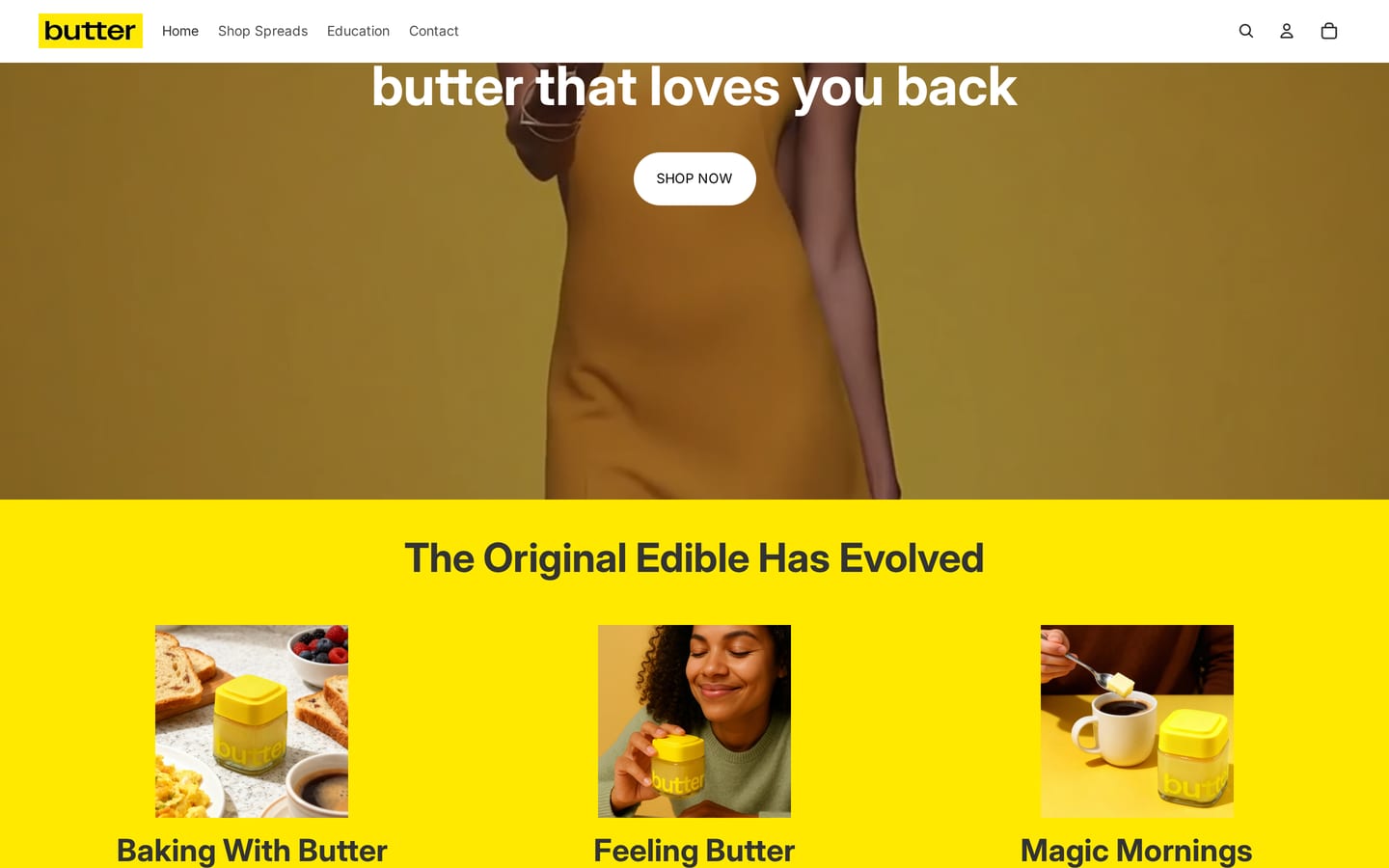 The top of butterspreads.com: a woman in yellow holding out a jar of butter, over the film, with butter that loves you back across it.