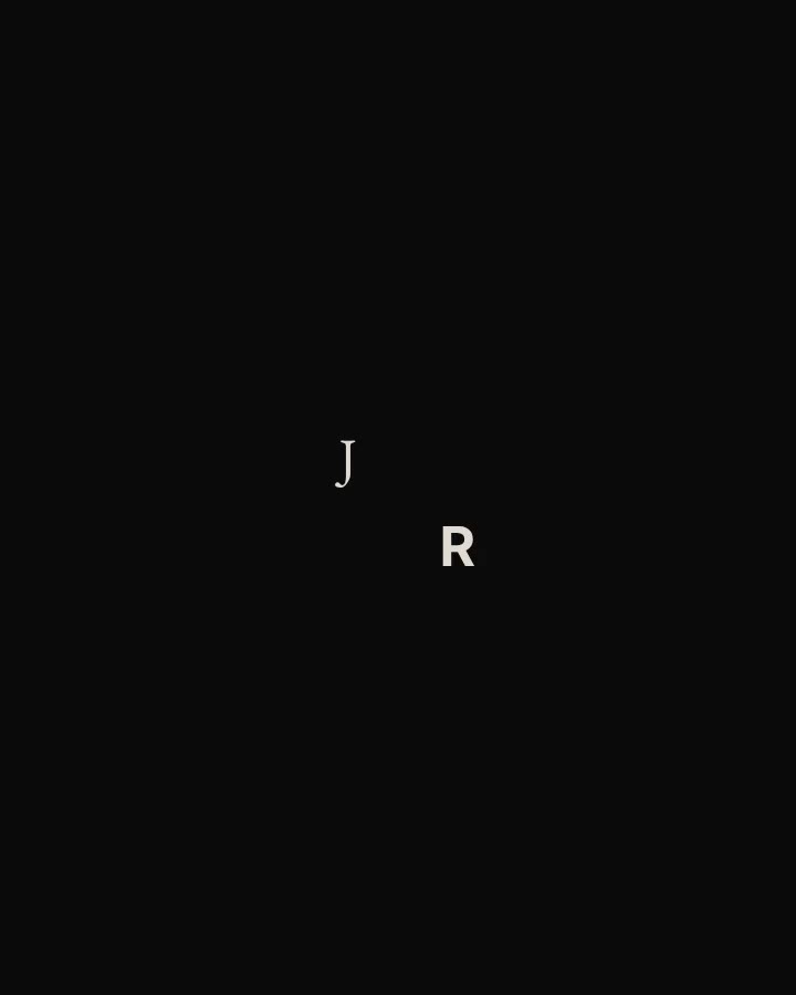 The splash as J and R resolve at the centre of a black screen.
